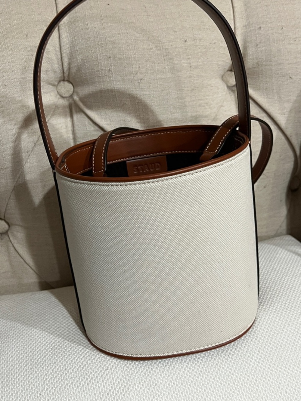 STAUD Cream Canvas Bucket Bag with Tan Leather Base